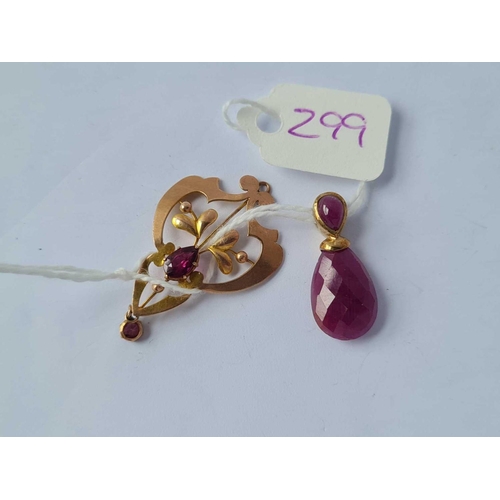 299 - Two gold garnet set pendants