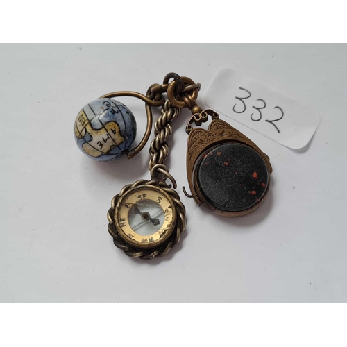 332 - A bag containing small porcelain globe and a metal fob etc