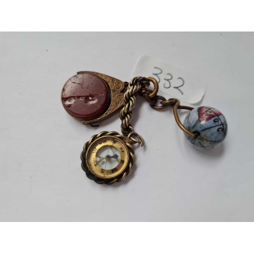 332 - A bag containing small porcelain globe and a metal fob etc