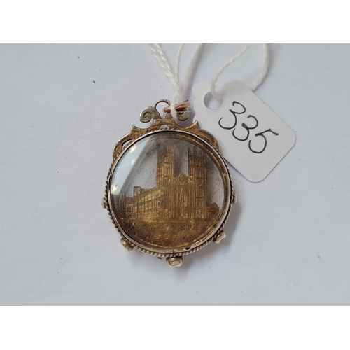 335 - A silver mounted Westminster Abbey pendant