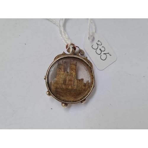 335 - A silver mounted Westminster Abbey pendant