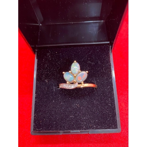 402 - A opal and diamond ring with opals in leaf design 10 ct gold size L - 2.3 gms