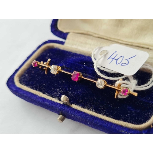 405 - A CASED GOOD BAR BROOCH SET WITH THREE GOOD BURMESE RUBIES AND TWO DIAMONDS MOUNTED IN HIGH CT GOLD