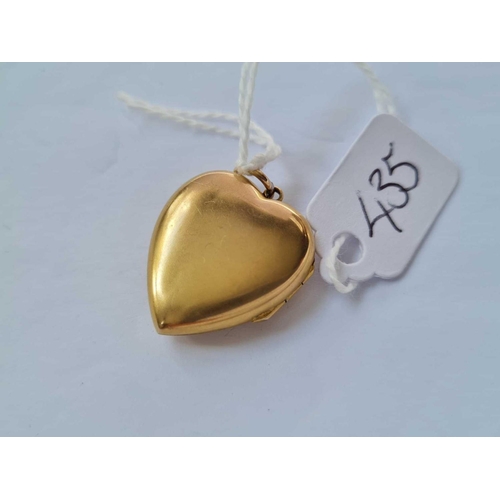 435 - A gold back & front stone set heart locket