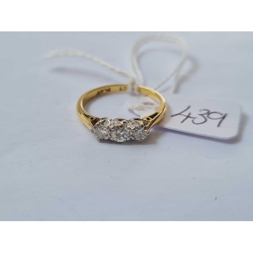 439 - Three stone diamond ring in 18ct gold mount size K