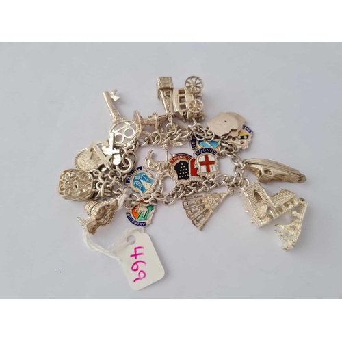 469 - A silver charm bracelet - 61 gms