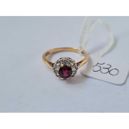 530 - A garnet and white stone 9ct cluster ring size O 2.7g inc