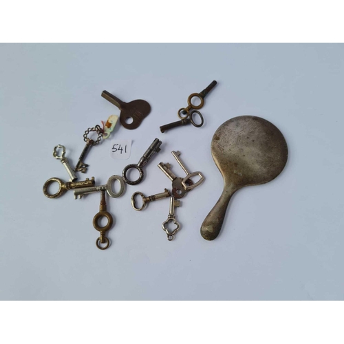 541 - A group of tiny keys and an EPNS hand bag mirror