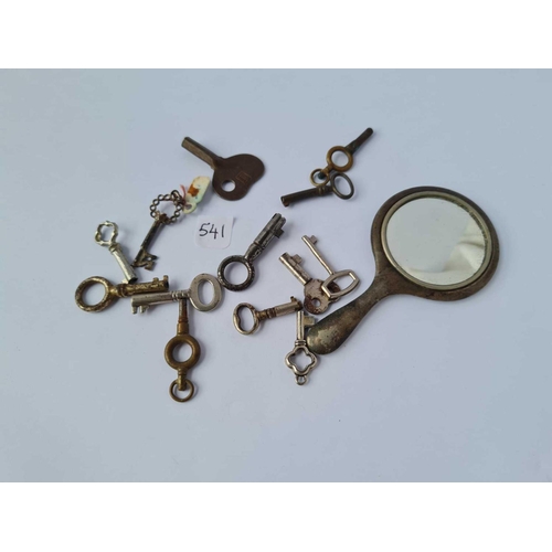 541 - A group of tiny keys and an EPNS hand bag mirror