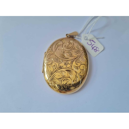 548 - A LARGE FLORAL ENGRAVED LOCKET 9CT - 23.5 GMS