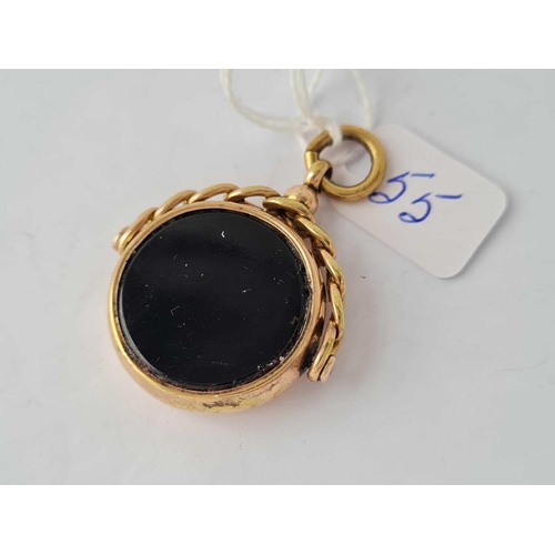 55 - A good large hard stone spinning fob set with cornelian and onyx  - 11 gms inc