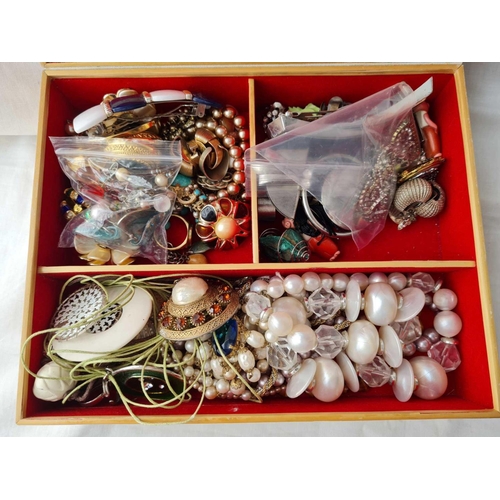 558 - A wooden box of costume jewellery