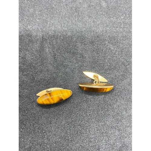 58 - A pair of nice large oval cufflinks with tigers eye panels 9ct - 6.8 gms inc