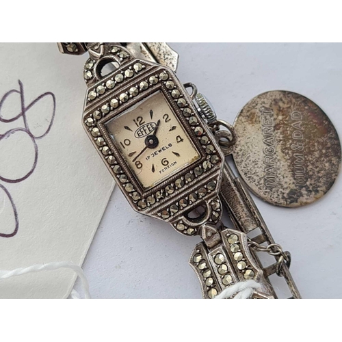 608 - A ladies silver and marcasite wrist watch with silver fob