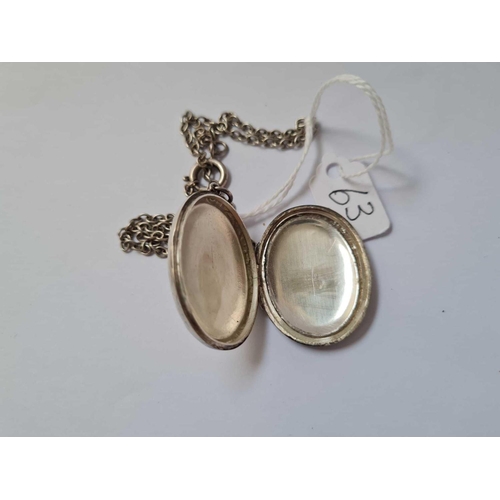 63 - A silver locket on silver chain 12.7g