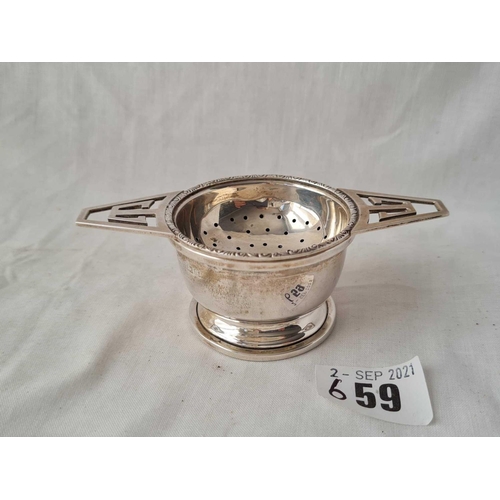 659 - An Art Deco style tea strainers on stand - 4.25