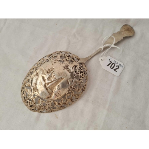 702 - A large cast decorative continental spoon, the bowl embossed with sailing boat - 81 g.