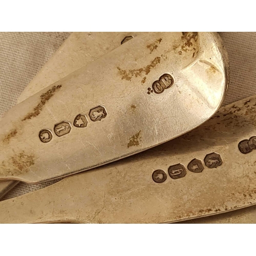 706 - Four early Victorian plain fiddle pattern dessert spoons - 1840, 1863 and two 1874