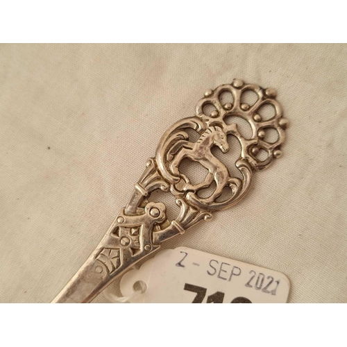 716 - A Danish silver (830 standard) spoon with pierced stem.