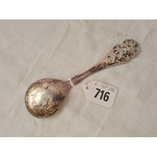 716 - A Danish silver (830 standard) spoon with pierced stem.