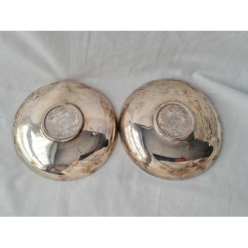 742 - A pair of dishes, the centres inset with a silver coin dated 1780 - 4.5