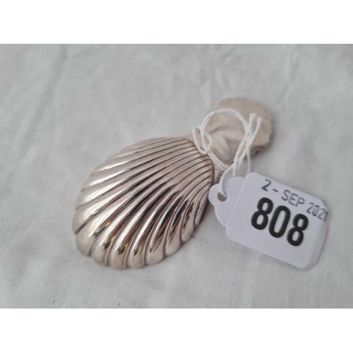 808 - A caddy spoon with shell decoration - Birmingham 1973