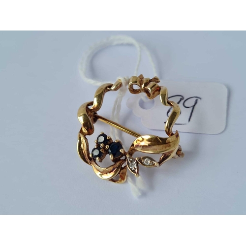 89 - A stylish sapphire & diamond wreath brooch 3.4g inc