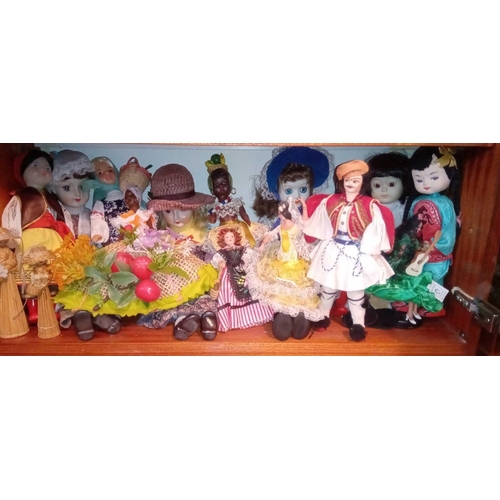 1955 - A shelf of oriental dolls