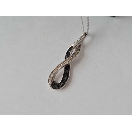1 - A suite of white gold pendant and earrings black and white diamonds 9ct