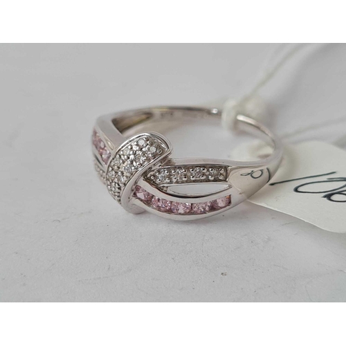 106 - A pink & white stone 9ct white gold ribbon design ring size  O 2.4g inc