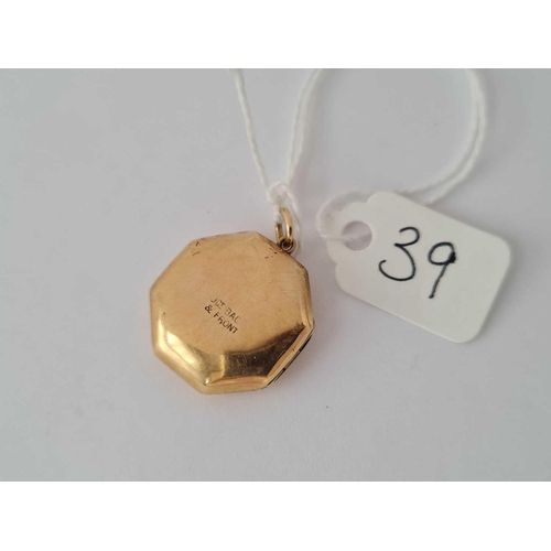 39 - An octagonal floral engraved back & front locket