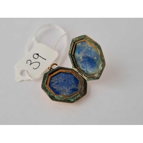 39 - An octagonal floral engraved back & front locket