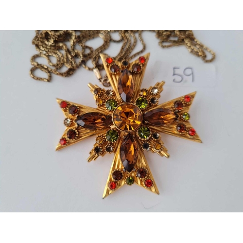 59 - A large (6cm)stone set pendant brooch on long RG muff chain