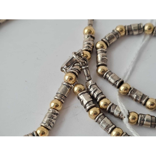 83 - A silver bead necklace and matching bracelet 41g