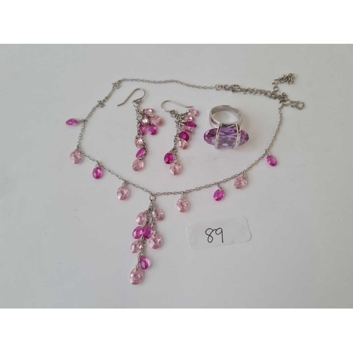89 - A silver necklace, earrings and ring