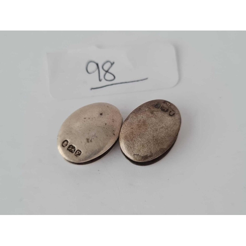 98 - A pair of oval Georgian silver cufflinks
