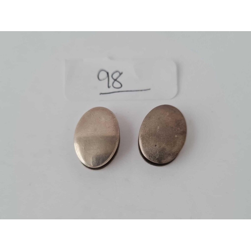 98 - A pair of oval Georgian silver cufflinks