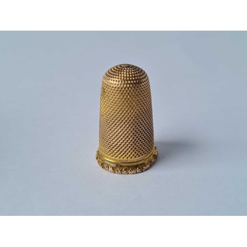 43 - A Victorian yellow metal thimble in case