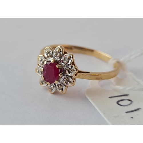 101 - A ruby and diamond flower head ring 9ct size R - 2.6 gms