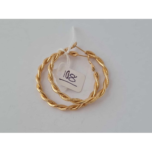 108 - A pair of large gold plated creole hoop earrings