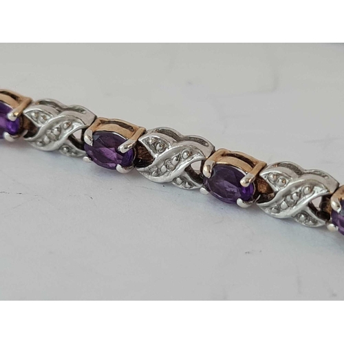 110 - A good amethyst and diamond line bracelet 9ct - 9.9 gms