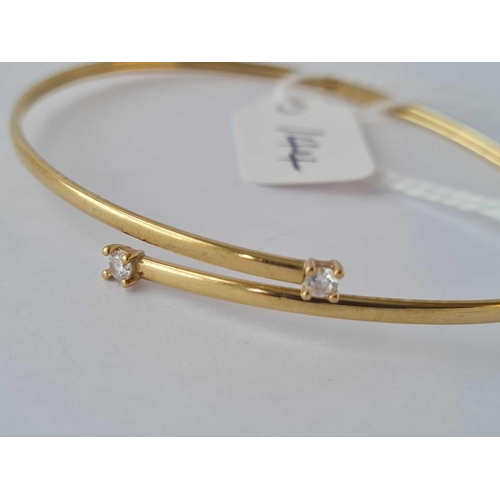 144 - A gold twist bangle stone set 9ct