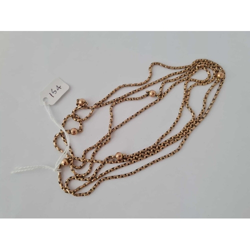 154 - ANTIQUE VICTORIAN 9CT GUARD CHAIN, SECRET LINK WITH BEADED SPACERS, LENGTH 56 INCHES.