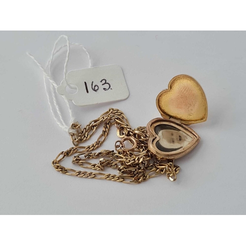 163 - A scroll engraved heart locket on Figaro link chain 14 inches 9ct - 6.5 gms