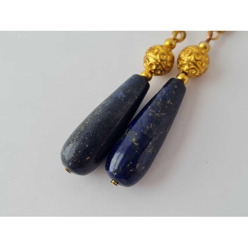 173 - A pair of large lapis lazuli ear pendants mounted in fancy gold mount