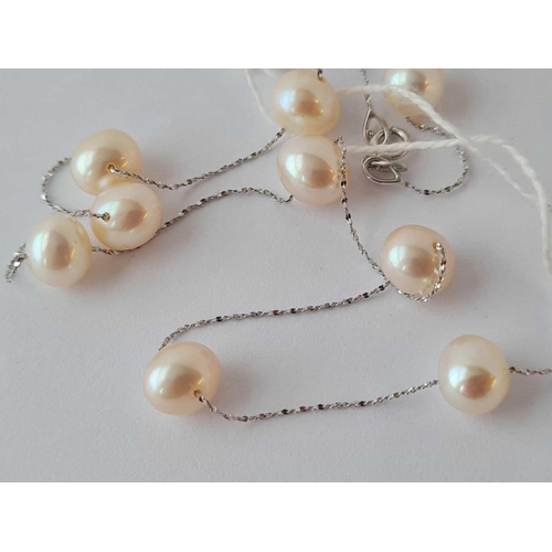 176 - A WHITE GOLD AND MUTI PEARL NECKLACE IN 14CT GOLD 16 INCHES