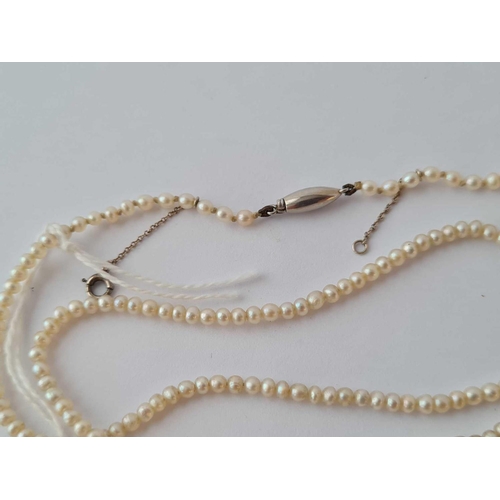 178 - A NATURAL PEARL NECKLACE WITH PLATINUM BARREL CLASP