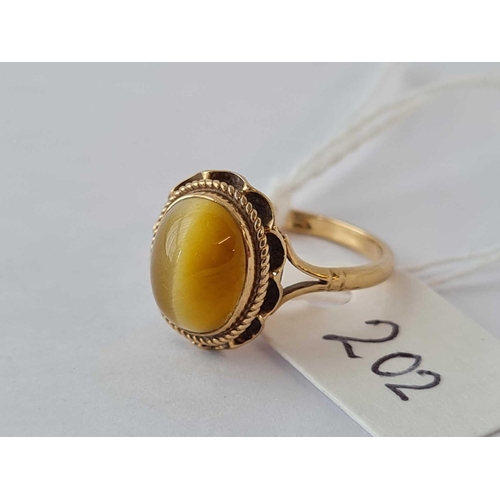 202 - A tigers eye ring 9ct size K - 2.3 gms