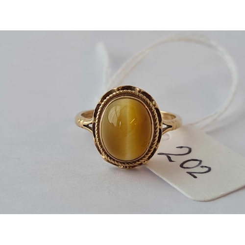 202 - A tigers eye ring 9ct size K - 2.3 gms