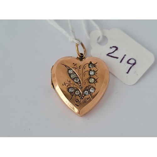 219 - Antique Victorian 9ct back & front heart shaped locket, flower design set with paste. Size without b... 